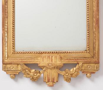 A Gustavian giltwood mirror by C. G. Fyrwald (master in Stockholm 1776-1825).