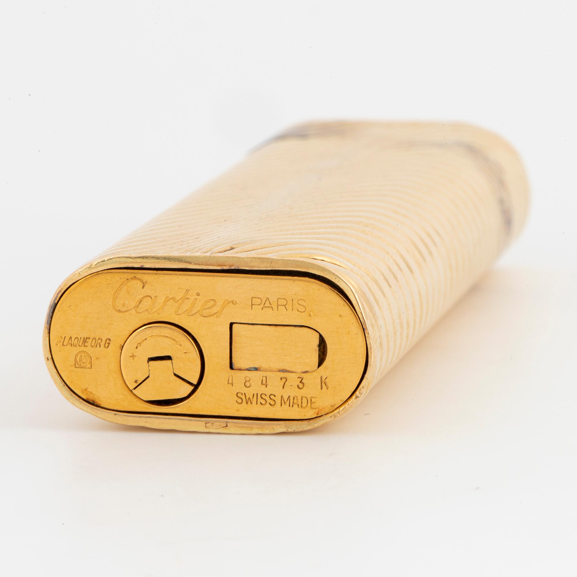 Cartier lighter with case 18K gold Elon Arenhill. Bukowskis