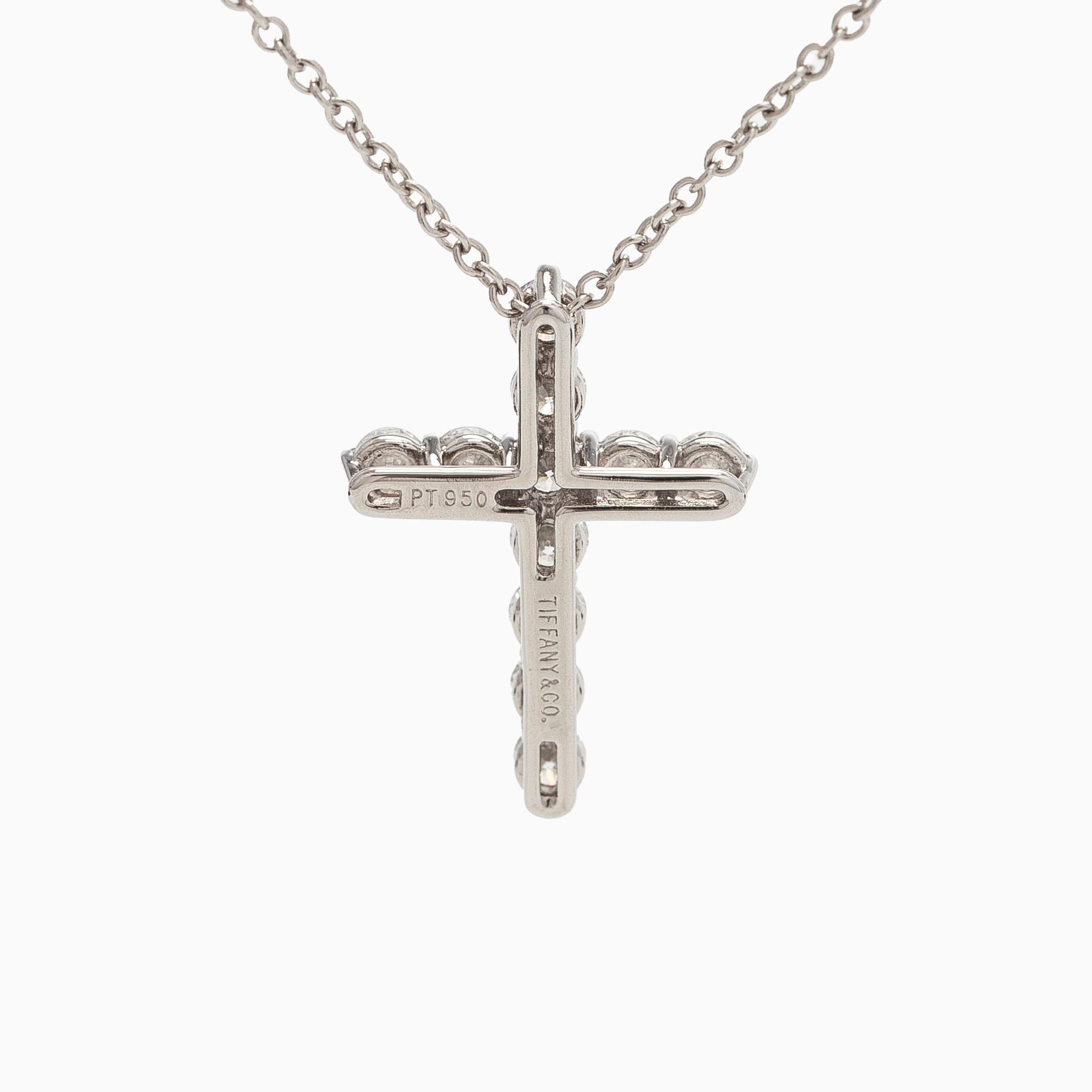 Tiffany & Co, a platinum cross pendant necklace with brilliant-cut diamonds.