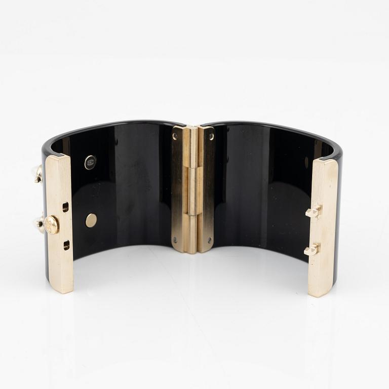 Chanel, a black acrylic bracelet with pearls, 2022.