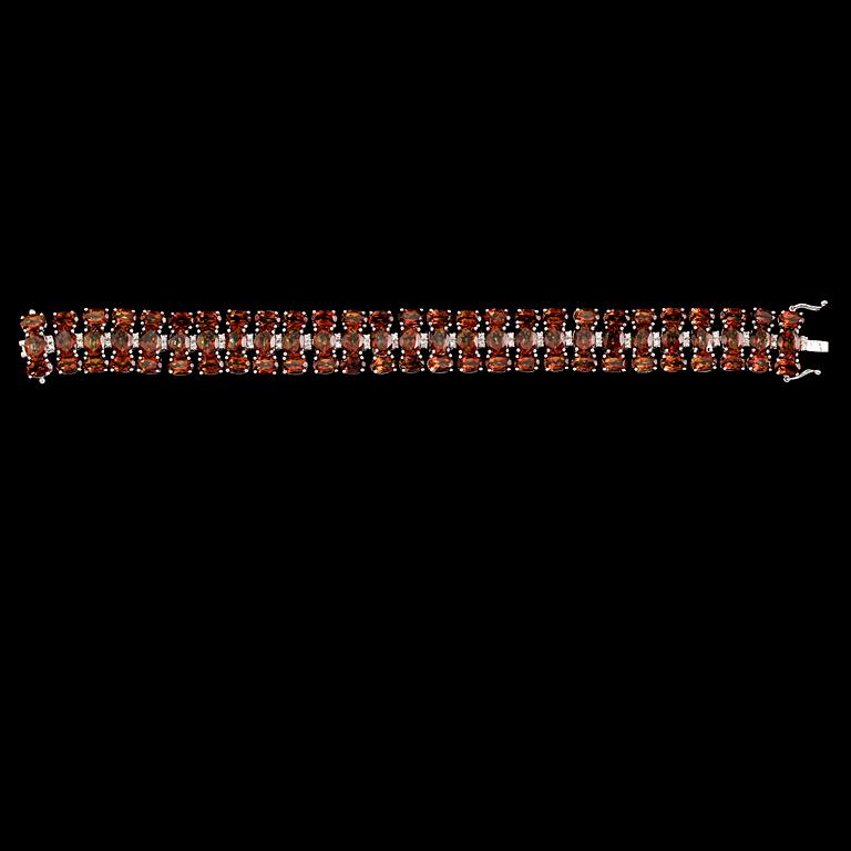 ARMBAND, sterlingsilver, vita topaser tot ca 0.50 ct, färgade topaser tot ca 48.00 ct.
