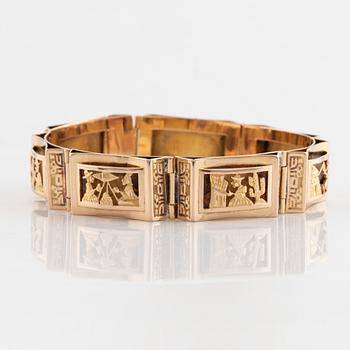 Gold panel bracelet.