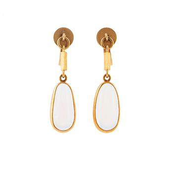 Wiwen Nilsson, a pair of 18K gold earrings set with cabochon-cut moonstones, Lund 1947.