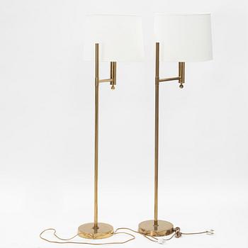 A pair of model 'G-18' brass floor lights, Bergboms, second half of the 20th Century.