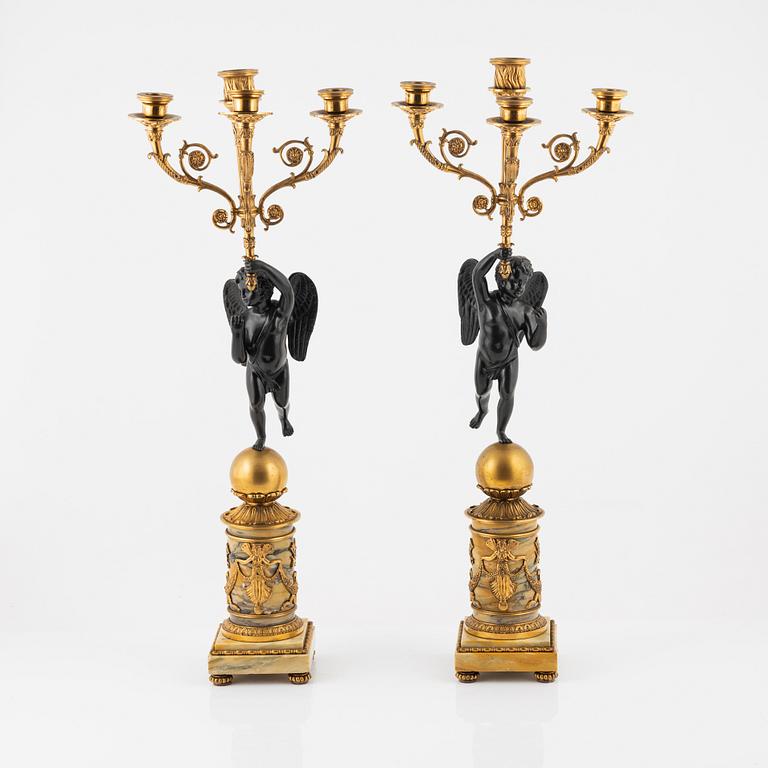 A pair of Empire-style ormolu and marble four-light candelabra, late 19th century.