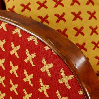 A pair of 1930s armchairs.