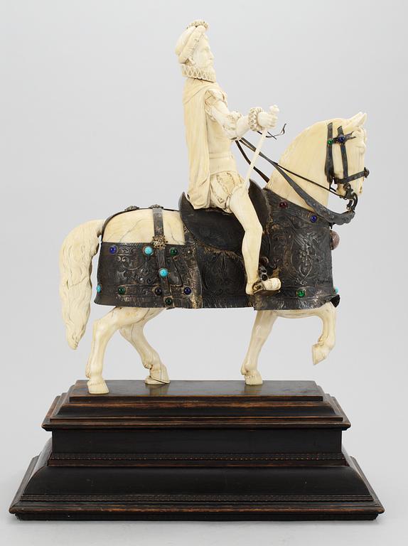 A late 19th century equestrian ivory, wood and metal statue.