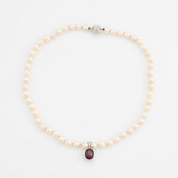 Cultured pearl necklace and cabochon cut ruby pendant.