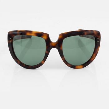 Oliver Goldsmith, a pair of  "Y-not" sunglasses.