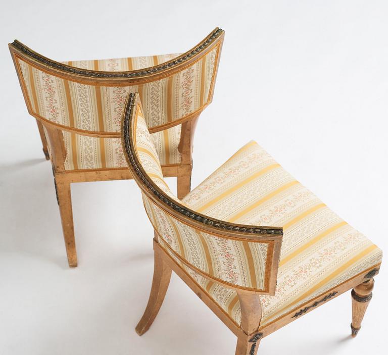 A pair of Late gustavian chairs in the manner of C G Gjörwell (1766-1837).