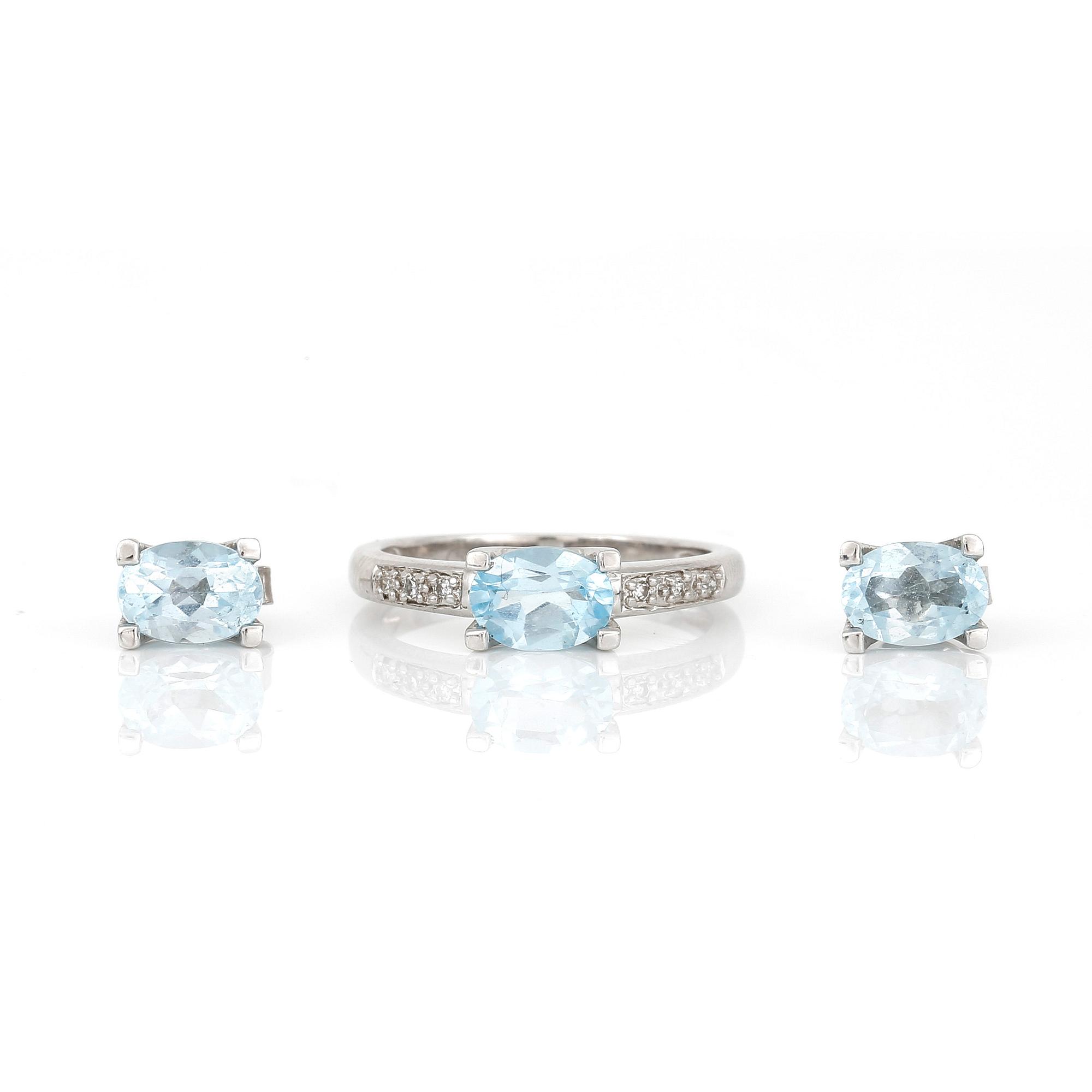 RING samt ÖRHÄNGEN, ett par, 18K vitguld med blå topaser, tot ca 2,80 ct. Total vikt ca 4,56 g.