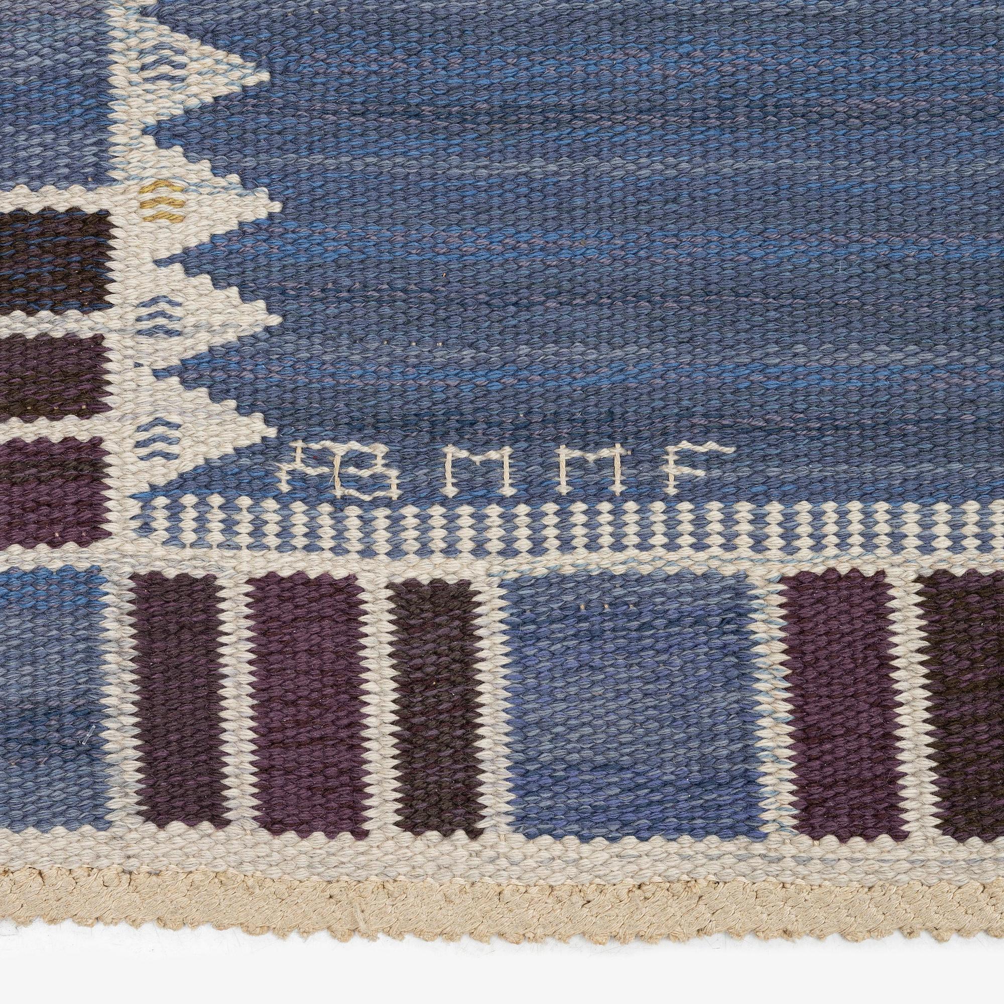Barbro Nilsson, a carpet, 'Salerno blå med enkel bård', flat weave, c. 365 x 244 cm, signed AB MMF BN.