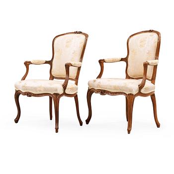 1227. Two matched Louis XV 18th century armchairs.