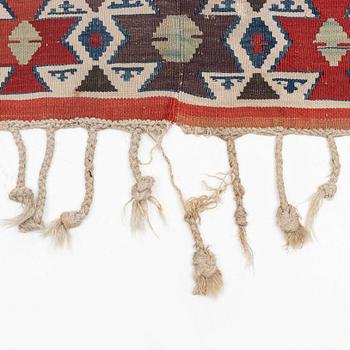 An antique Anatolian kilim, ca 324 x 169 cm.