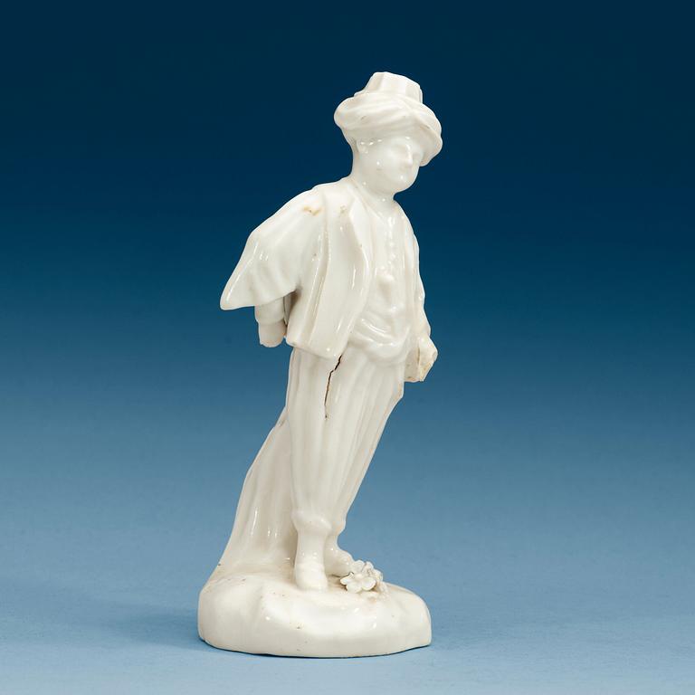 A Swedish Marieberg soft paste figure of a boy clad in Turkish garments, 18th Century.