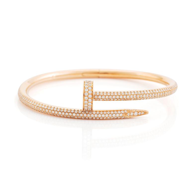 A Cartier "Juste en Clou" bracelet in 18K rose gold set with round brilliant-cut diamonds.