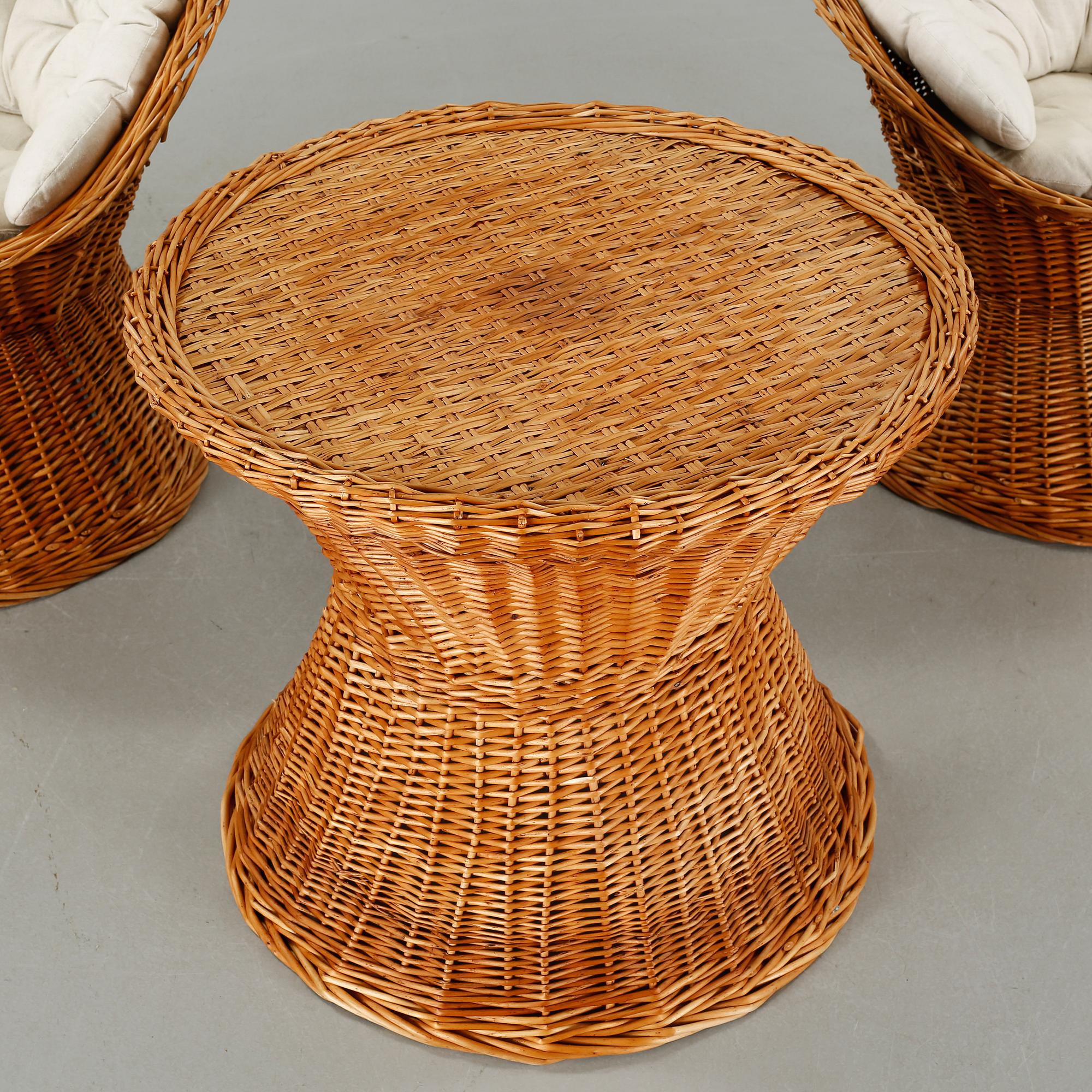 A pair of chairs and one table from the latter half of the 20th century.