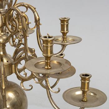 A brass Baroque style chandelier, 20th Century.