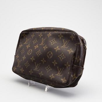 A Louis Vuitton toiletry bag.