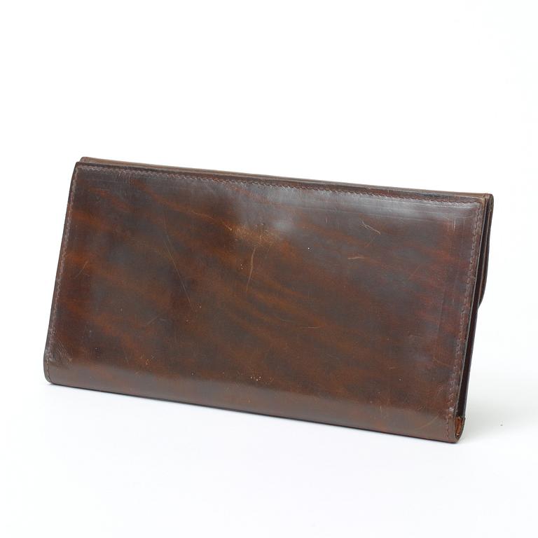 An darkbrown leather evening bag/wallet by Celine.