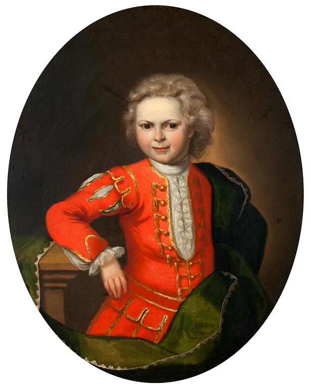Portrait of a boy in red suit.