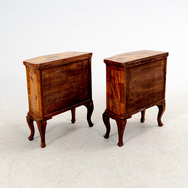 A pair of walnut veneered bedside tables from the second half ot the 20th century.