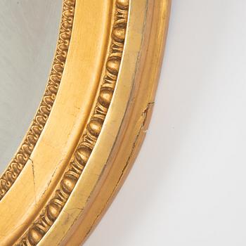 A Gustavian giltwood one-branch girandole mirror, Stockholm, late 18th century.