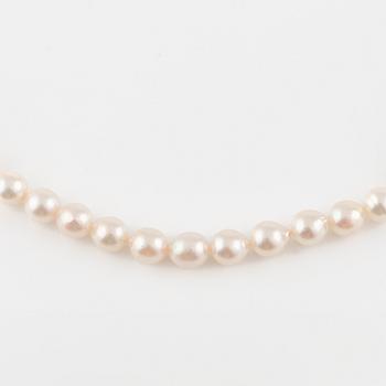 Three strands of cultured pearls, without clasps.