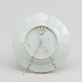 A famille rose dish and two dinner plates, Qing dynasty, Qianlong (1736-95).