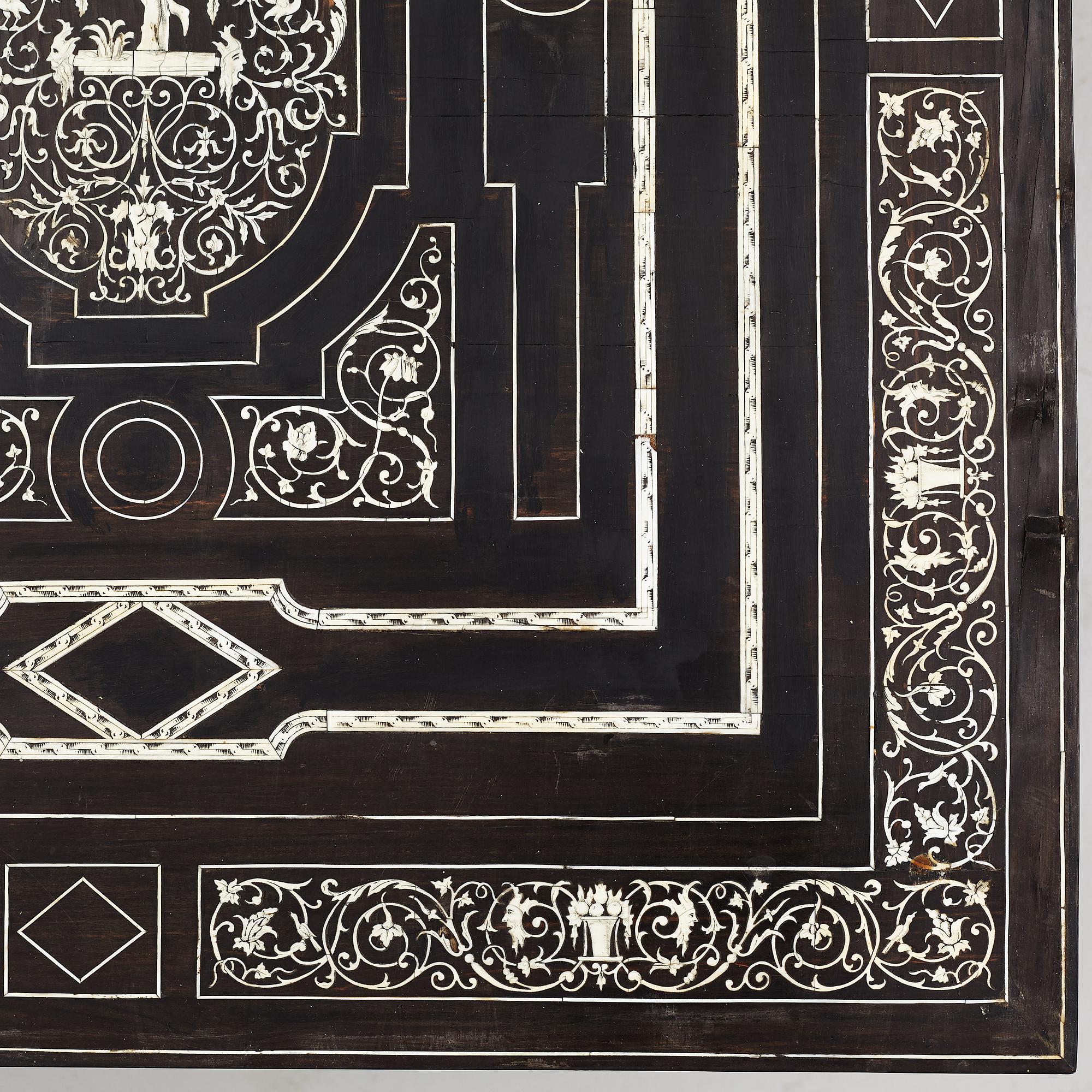 A Renaissance-style ebony, ebonized and ivory-inlaid library table, late 19th century, presumably Germany.