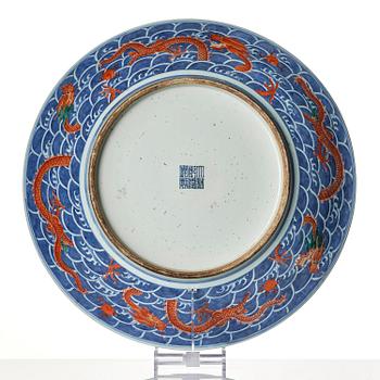 A massive nine dragon charger, Qing dynasty with Qianlong mark.