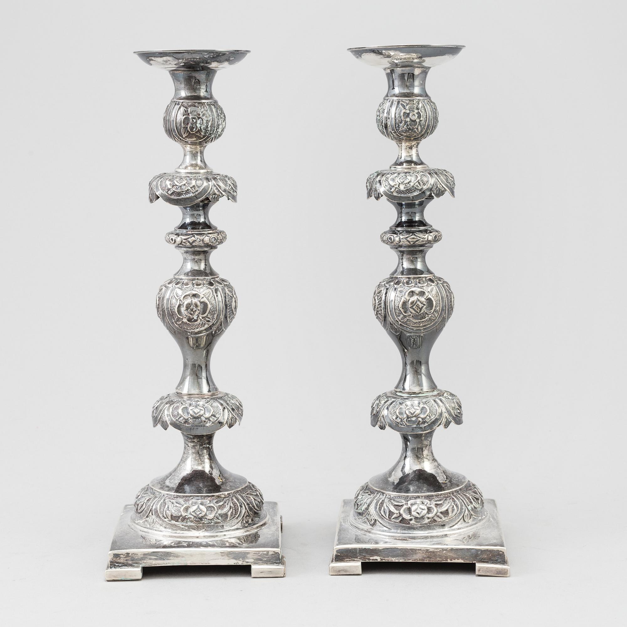 A pair of silver Sabbath candlesticks, Maker M. Sztern, Warsaw, Poland. Assayer Josef Sosnkowski, 1864. Weight 833 g.