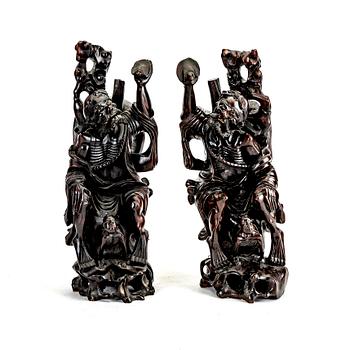 A pair of Japanese wooden sculptures, early 20th Century.