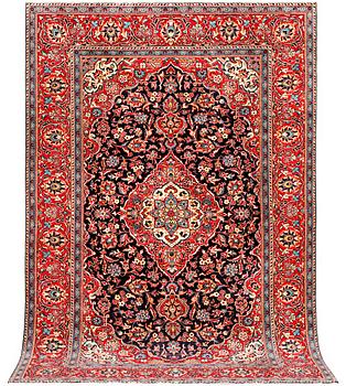A Kashan carpet. a. 300 x 195 cm.