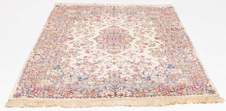 A carpet, semi-antique/old, Kerman, approx. 263 x 174 cm.
