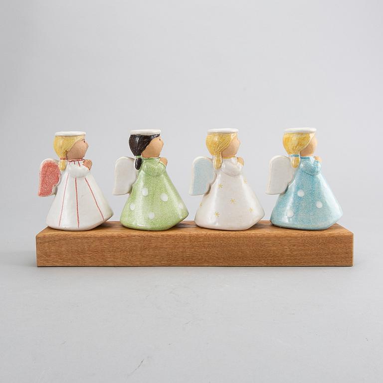 LISA LARSON, a signed candlestick.