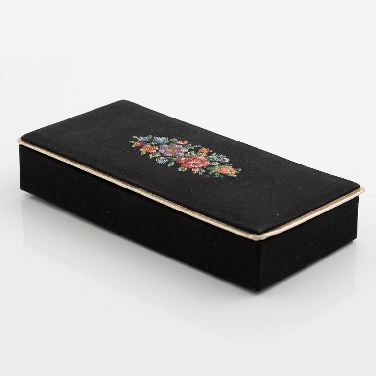 Necklace with matching earrings, white metal in floral design with glass stones.