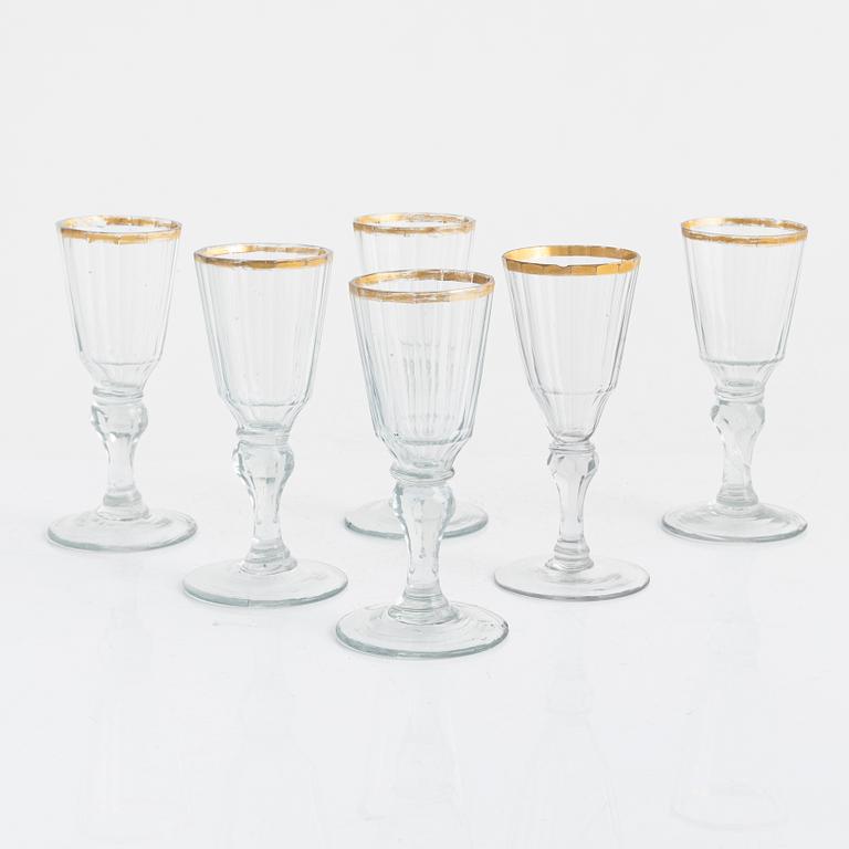 A set of six gold-rimmed glasses, early 19th century.