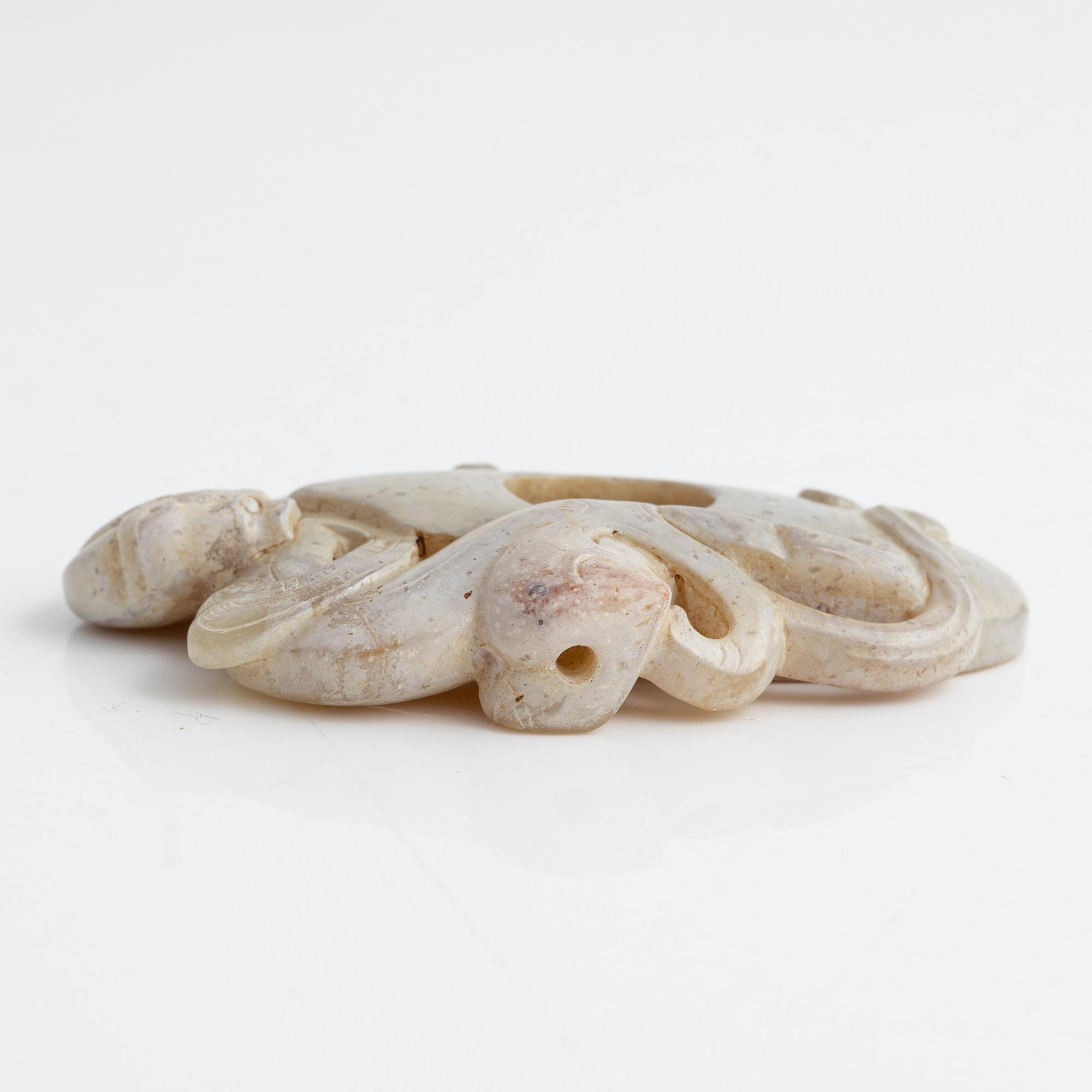An archaistically carved nephrite sculpture, China, 20th Century.