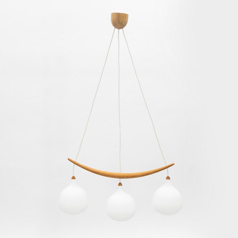 Uno & Östen Kristiansson, a 'Bananen' oak and glass three-light ceiling lamp, Luxus, Vittsjö.