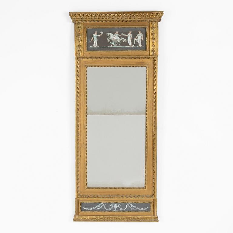 A late Gustavian giltwood and inset gouache mirror, circa 1800.