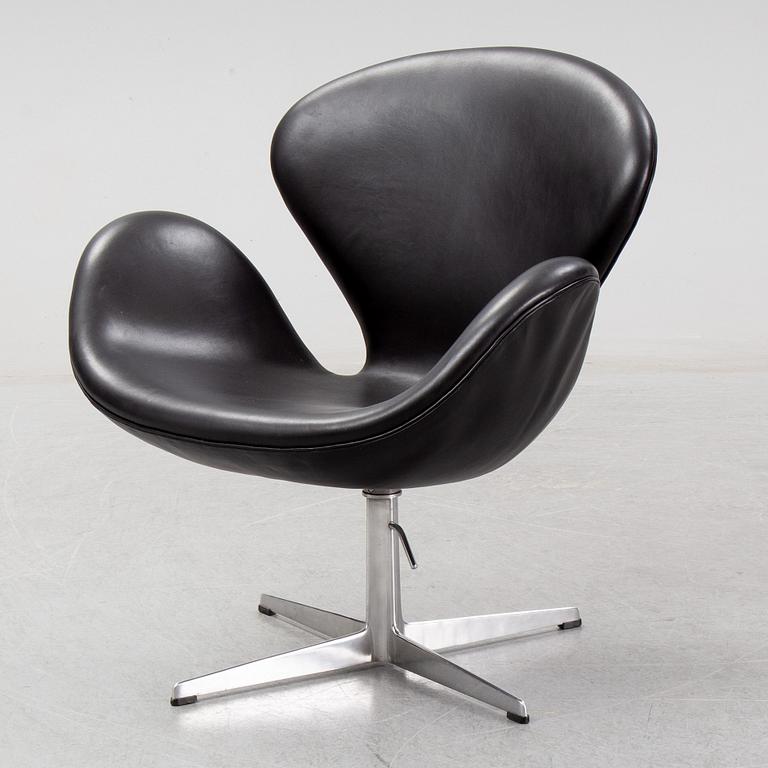 Arne Jacobsen, a black leather 'Swan' chair, Fritz Hansen, Denmark, 1967.