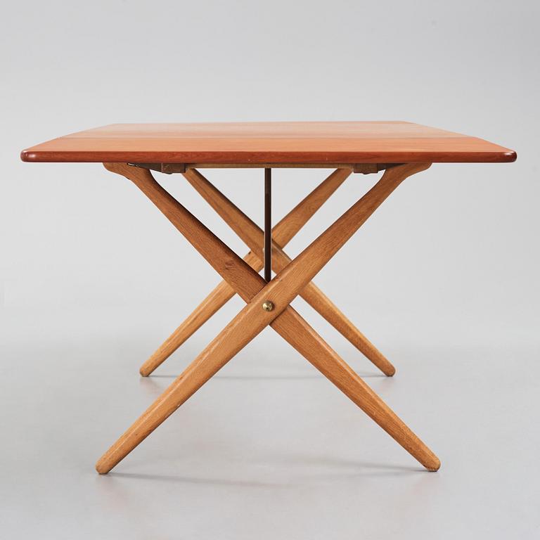 Hans J. Wegner, a teak and oak drop-leaf dining table, Andreas Tuck, Denmark 1950s-1960s.