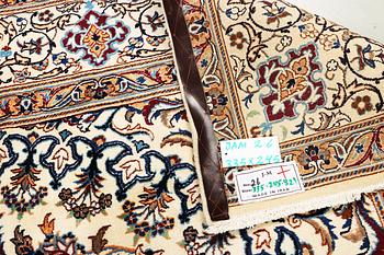 A Nain carpet, 9 laa, part silk, Iran, c. 335 x 245 cm.