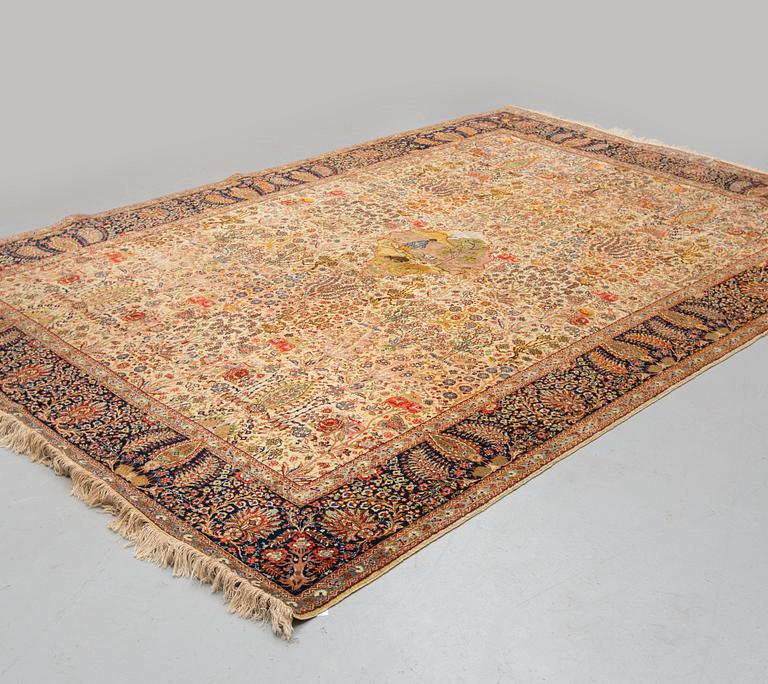 A CARPET, a semi-antique Tabriz probably, figural, ca 325,5 x 226 cm.