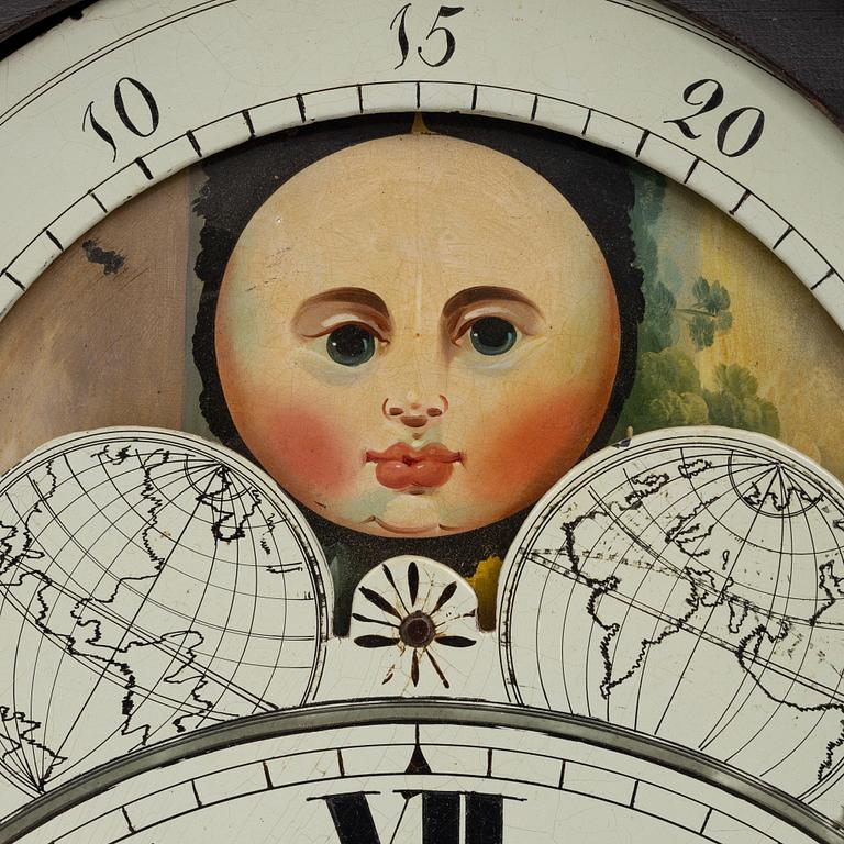 A long-case clock, England, 19th century.