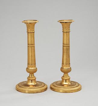 258. A pair of Empire candlesticks, 19th Century.