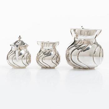 A sterling silver jug, milk jug and sugar bowl, possibly Mexico, mid20th century.
