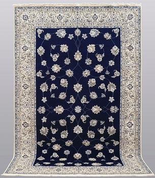 A carpet, Nain part silk s.k 9LAA, ca 312 x 199 cm.
