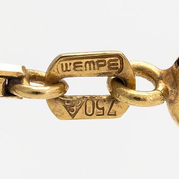 A Lalique heart pendant with an 18K gold chain.